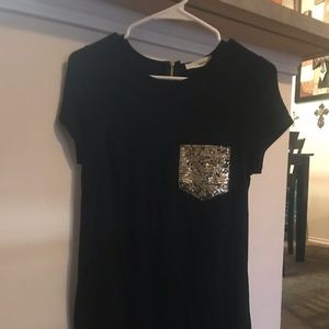 Dress with glitter pocket and zip back.